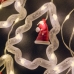 Світлодіодна гірлянда-завіса прозорий дріт Фігурки в ялинці 10 LED Magic Lights 3 х 0.6 м теплий білий